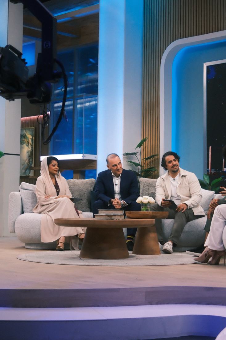 Dua hosting a panel discussion on set